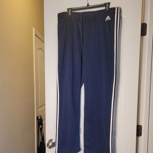 Adidas Men Blue Joggers with White Stripes and drawstring.